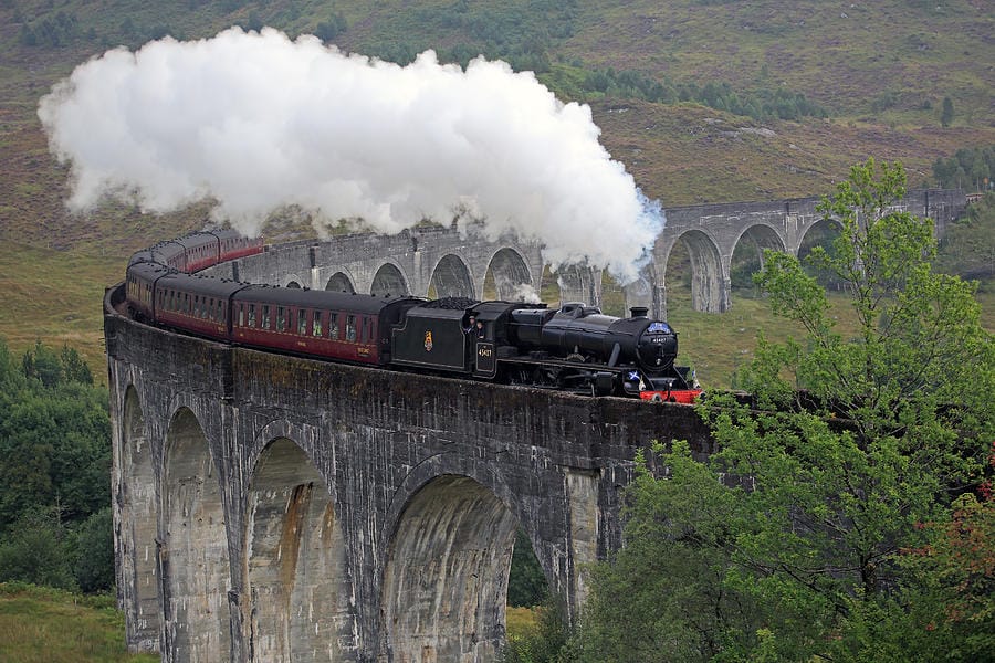 The Jacobite steam train crossing the Glenfinnan Viaduct, as seen in many of the Harry Potter movies