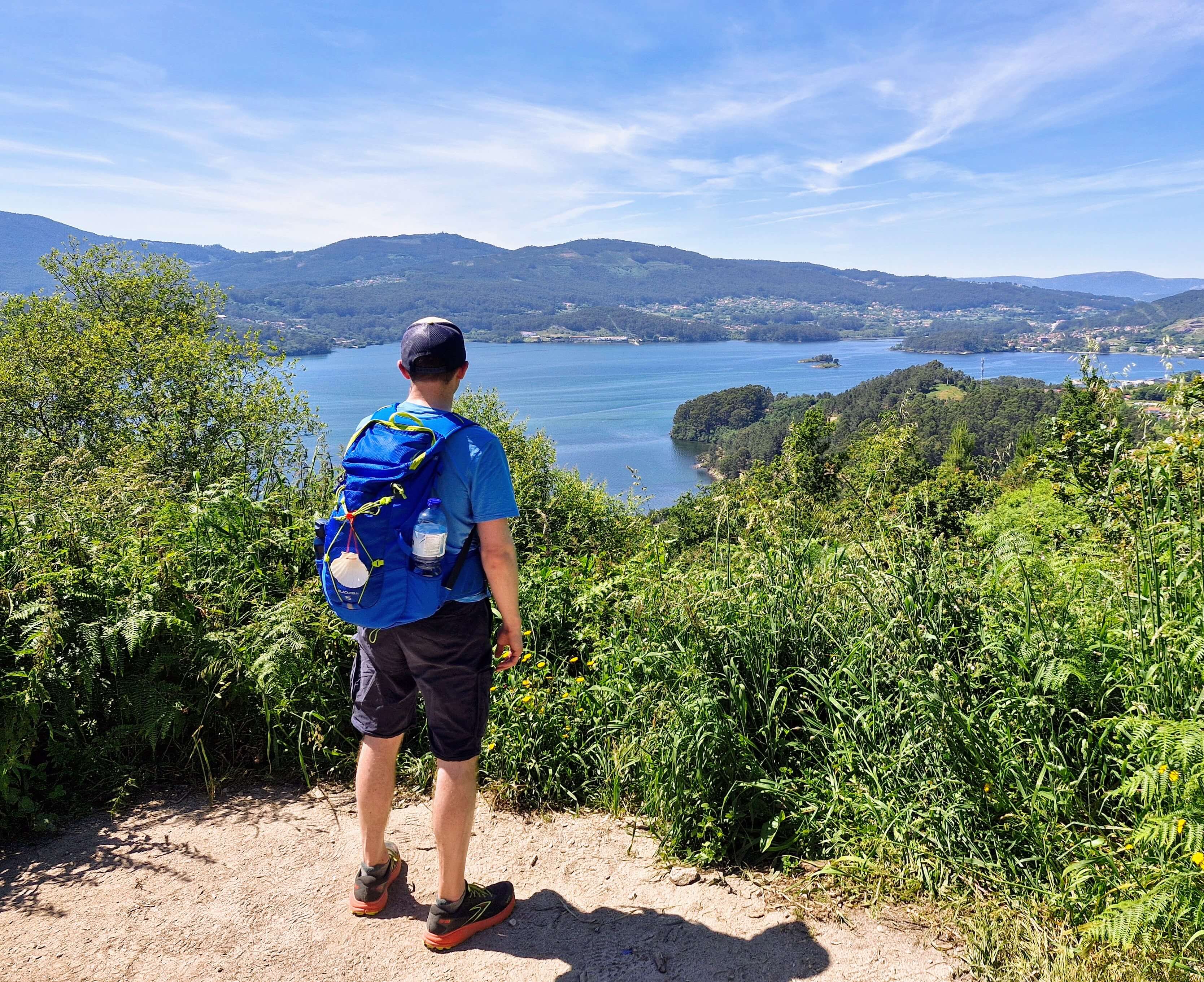 Camino Walkers looking out over Vigo Bay near Arcade
