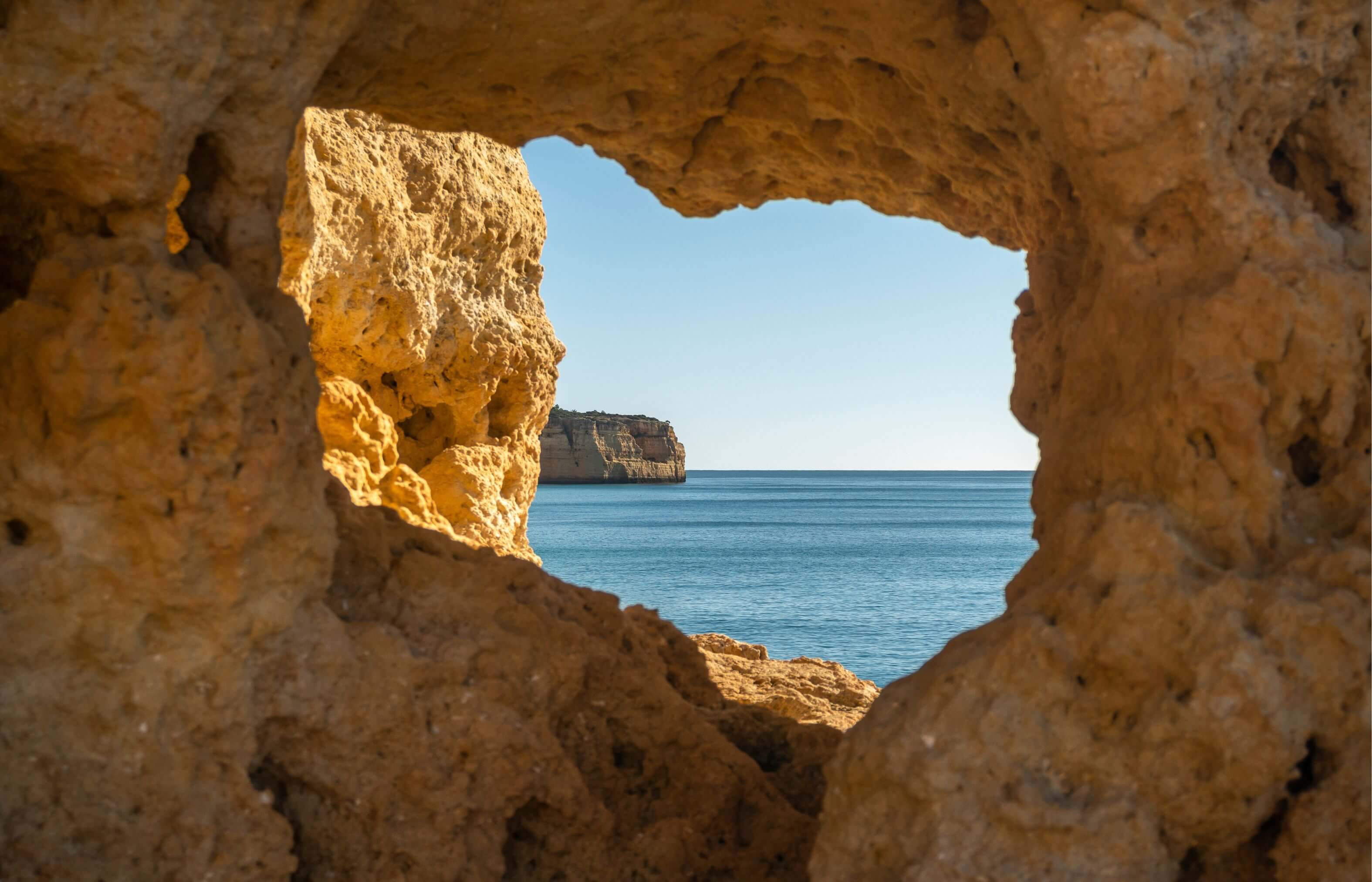 gsw algar seco view through rock window coastline distant